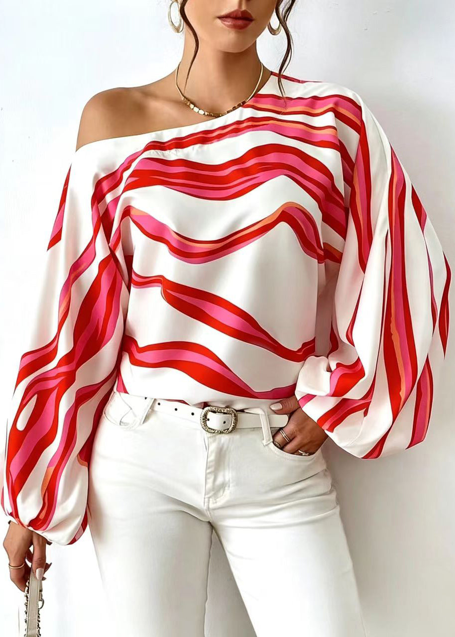 Damebluse med en skulder og lange ermer i stripet design 1