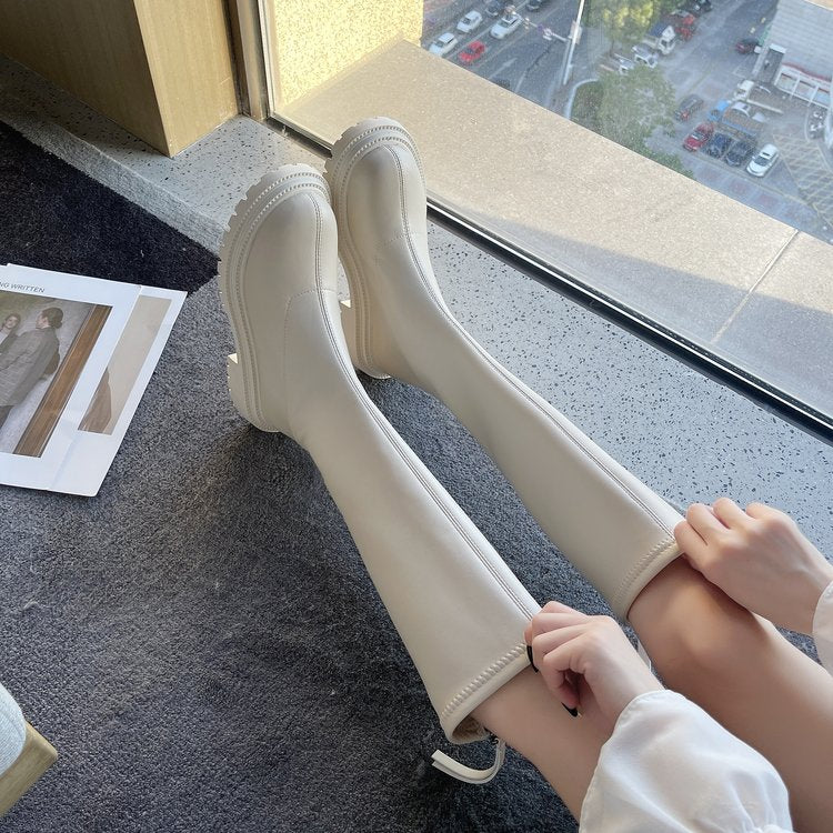 Lange Kunstskinntøvler for kvinner