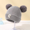 Ull Strikket Baby Bonnet