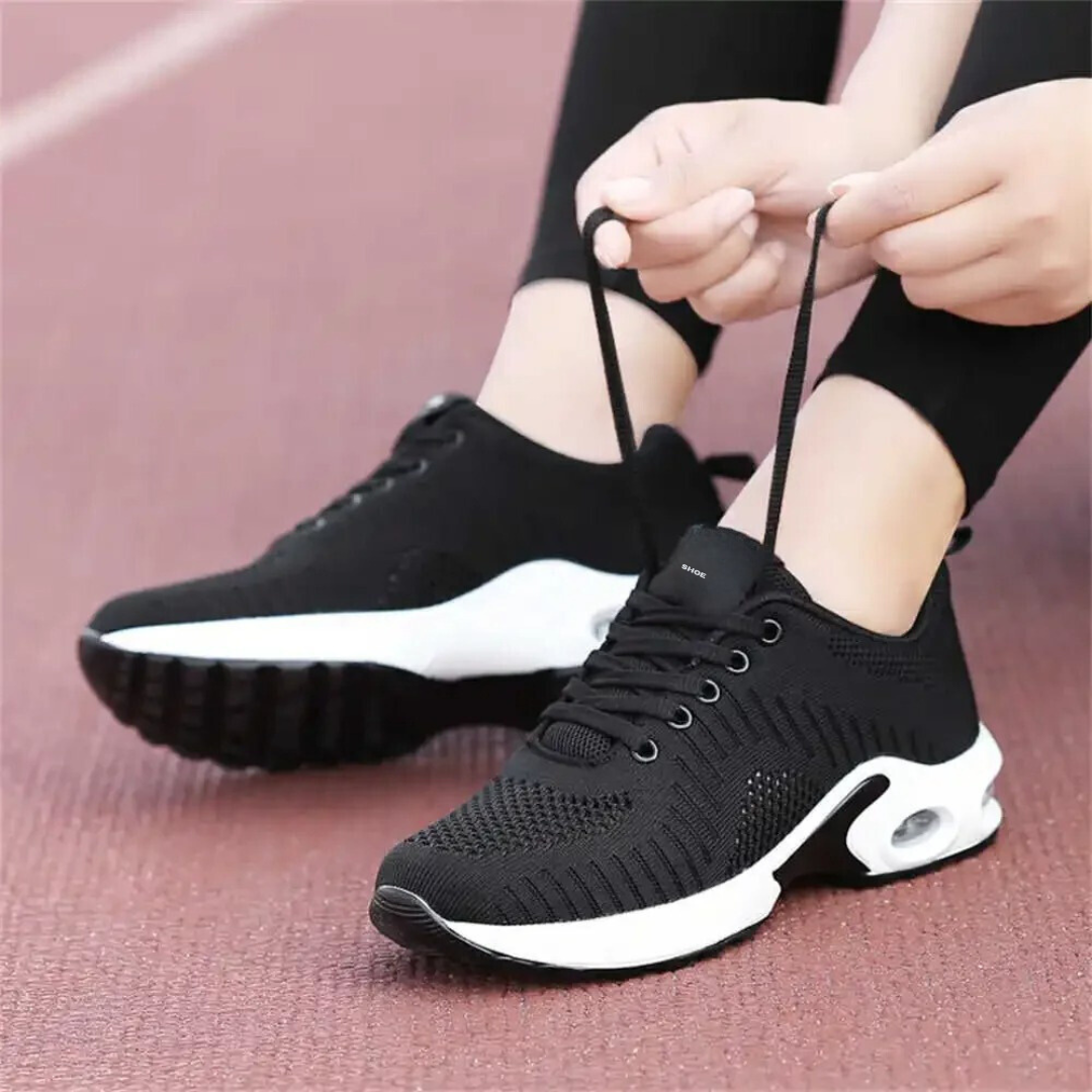 Friidrettssko med støtte i fotbuen for kvinner