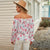 Blomstret bluse med volanger