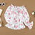 Blomstret bluse med volanger